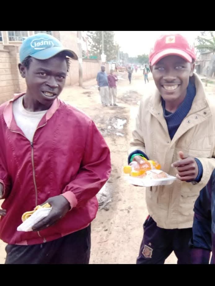 Volunteers serving food during street outreach